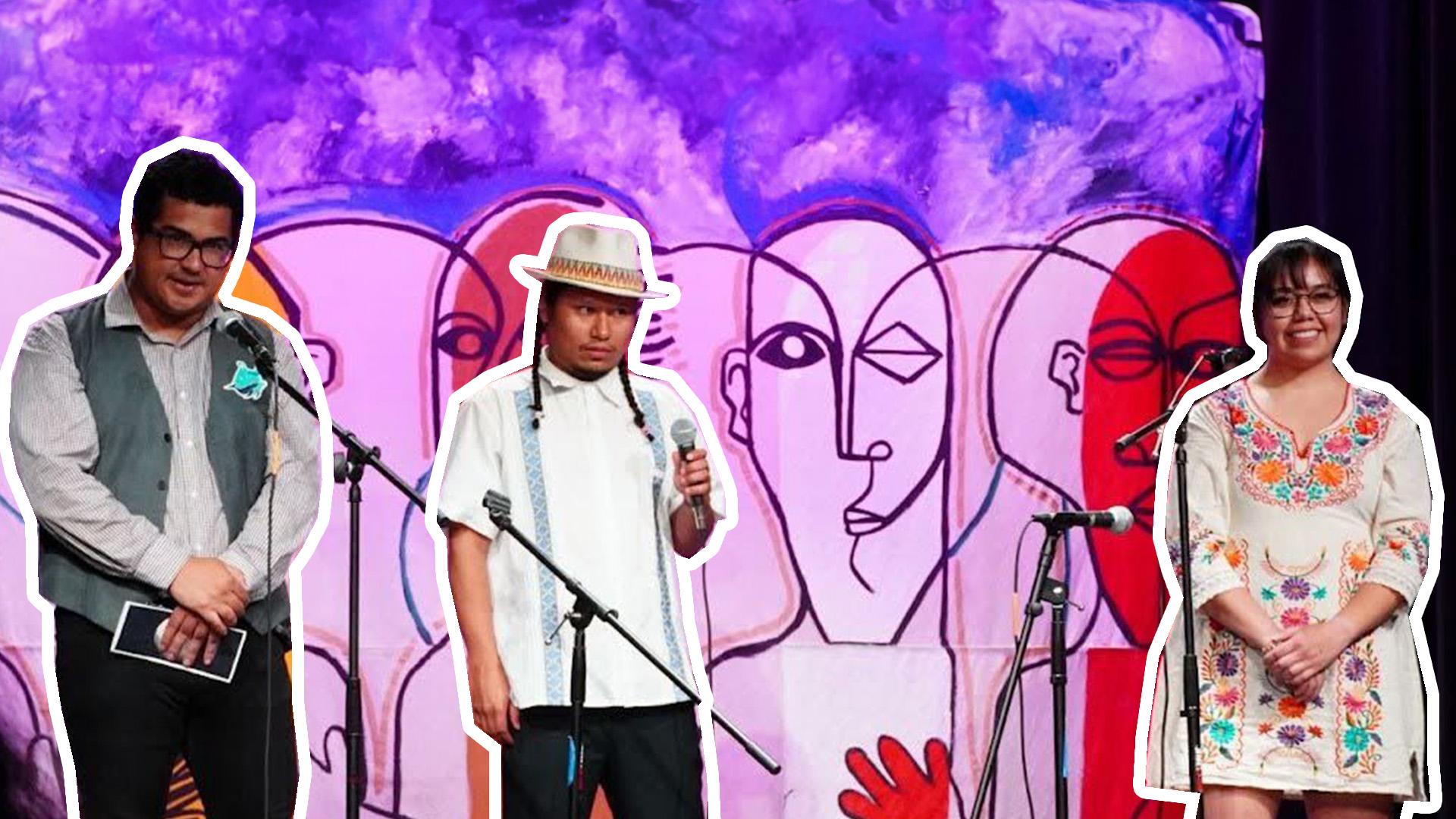 Three presenters on stage at an event